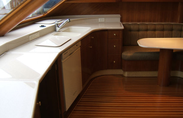 Complete and partial high impact solid surface custom interiors for boats and marine heads.